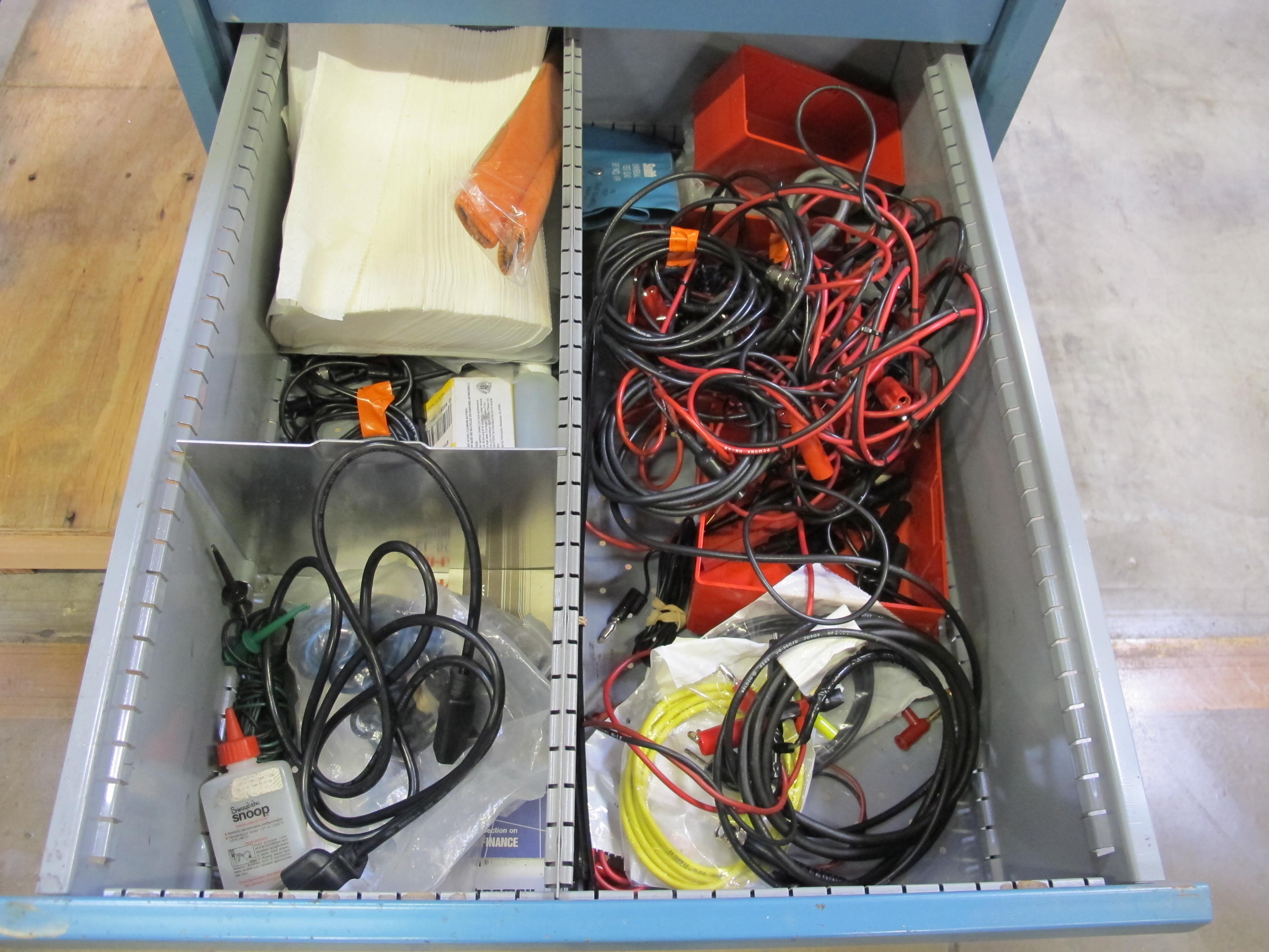 LISTA INDUSTRIAL WORK DESK, BUTCHER BLOCK TABLE TOP 48"L X 30"W, SHELF, 4 DRAWER CABINET WITH CONTENTS TO INCLUDE: MISC. OFFICE SUPPLIES, CABLES, SAFETY GLASSES, ELECTRIC TESTING WIRE. LOADING & HANDLING $15-1692