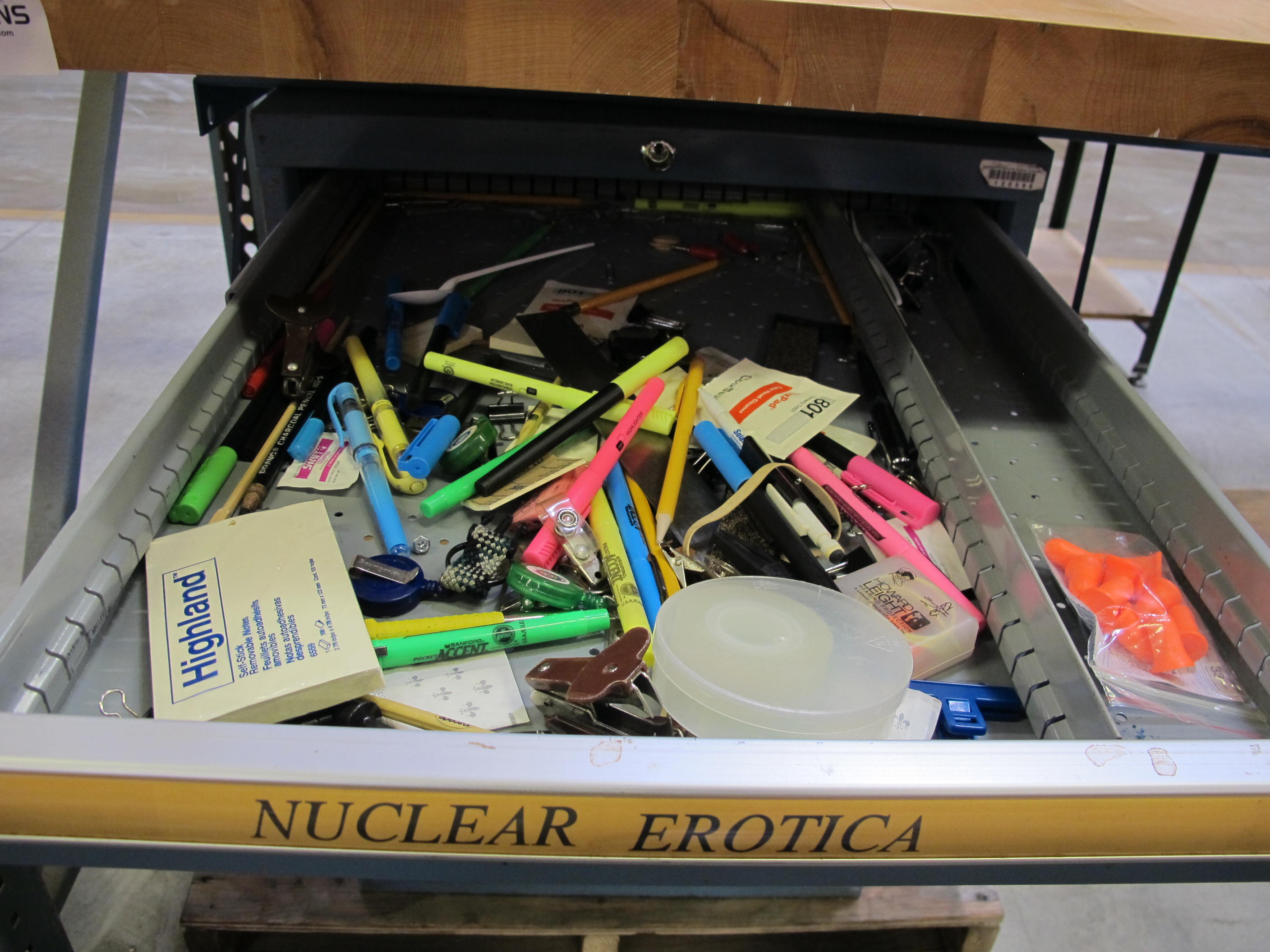 LISTA INDUSTRIAL WORK DESK, BUTCHER BLOCK TABLE TOP 60"L X 30"W, 5 DRAWER CABINET WITH CONTENTS TO INCLUDE: MISC. OFFICE SUPPLIES, EAR PLUGS, SAFETY GLASSES, ELECTRIC TEST WIRE, . LOADING & HANDLING $15-1693