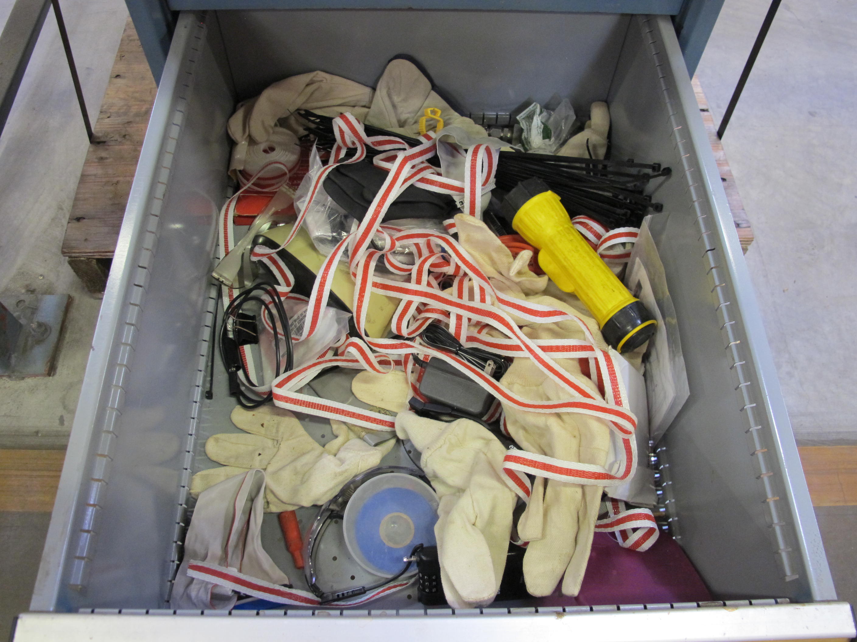 LISTA INDUSTRIAL WORK DESK, BUTCHER BLOCK TABLE TOP 60"L X 30"W, 5 DRAWER CABINET WITH CONTENTS TO INCLUDE: MISC. OFFICE SUPPLIES, EAR PLUGS, SAFETY GLASSES, ELECTRIC TEST WIRE, . LOADING & HANDLING $15-1693