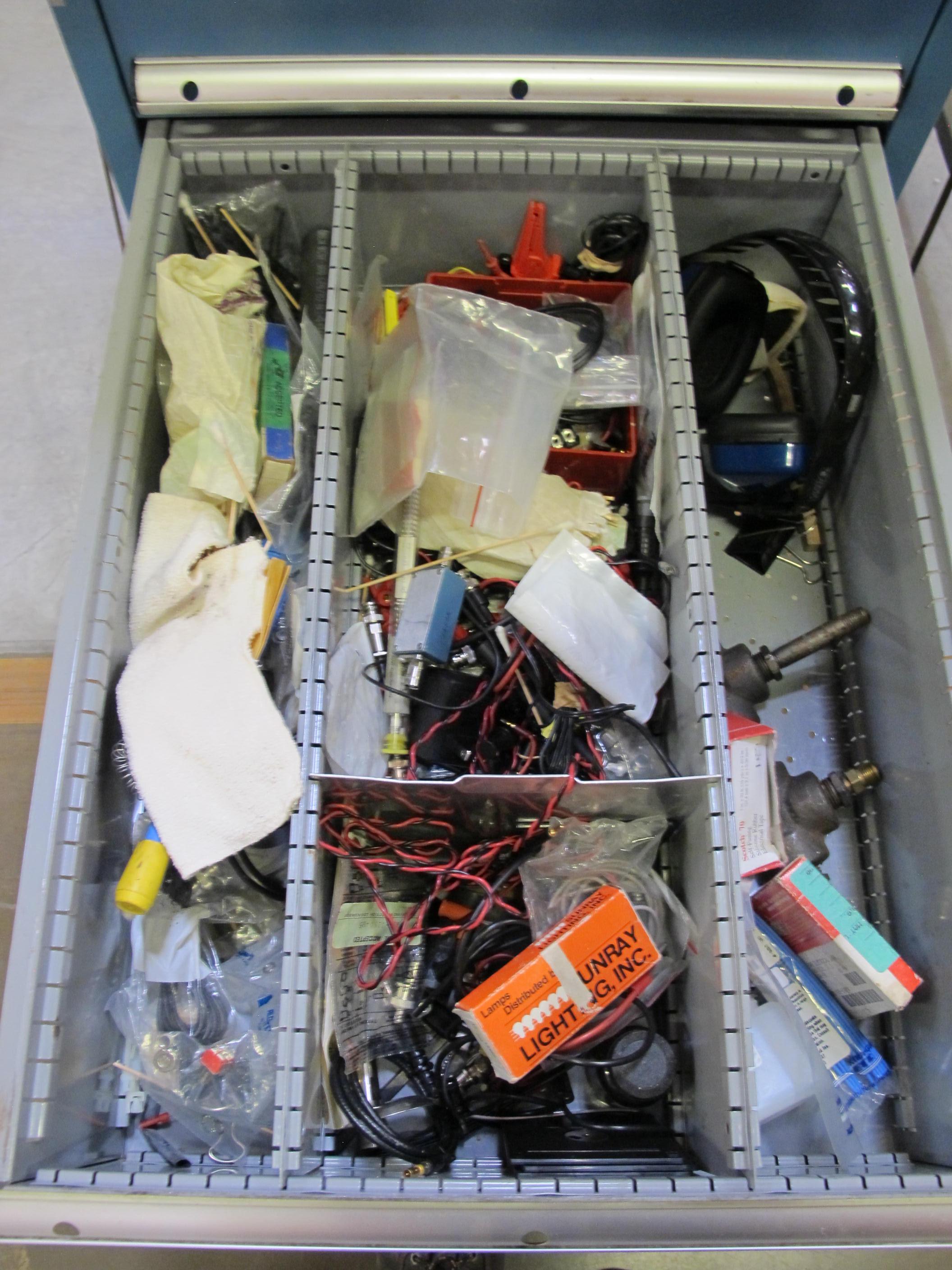 LISTA INDUSTRIAL WORK DESK, BUTCHER BLOCK TABLE TOP 60"L X 30"W, 5 DRAWER CABINET WITH CONTENTS TO INCLUDE: MISC. OFFICE SUPPLIES, TEST WIRE, EAR MUFFS. LOADING & HANDLING $15-1694