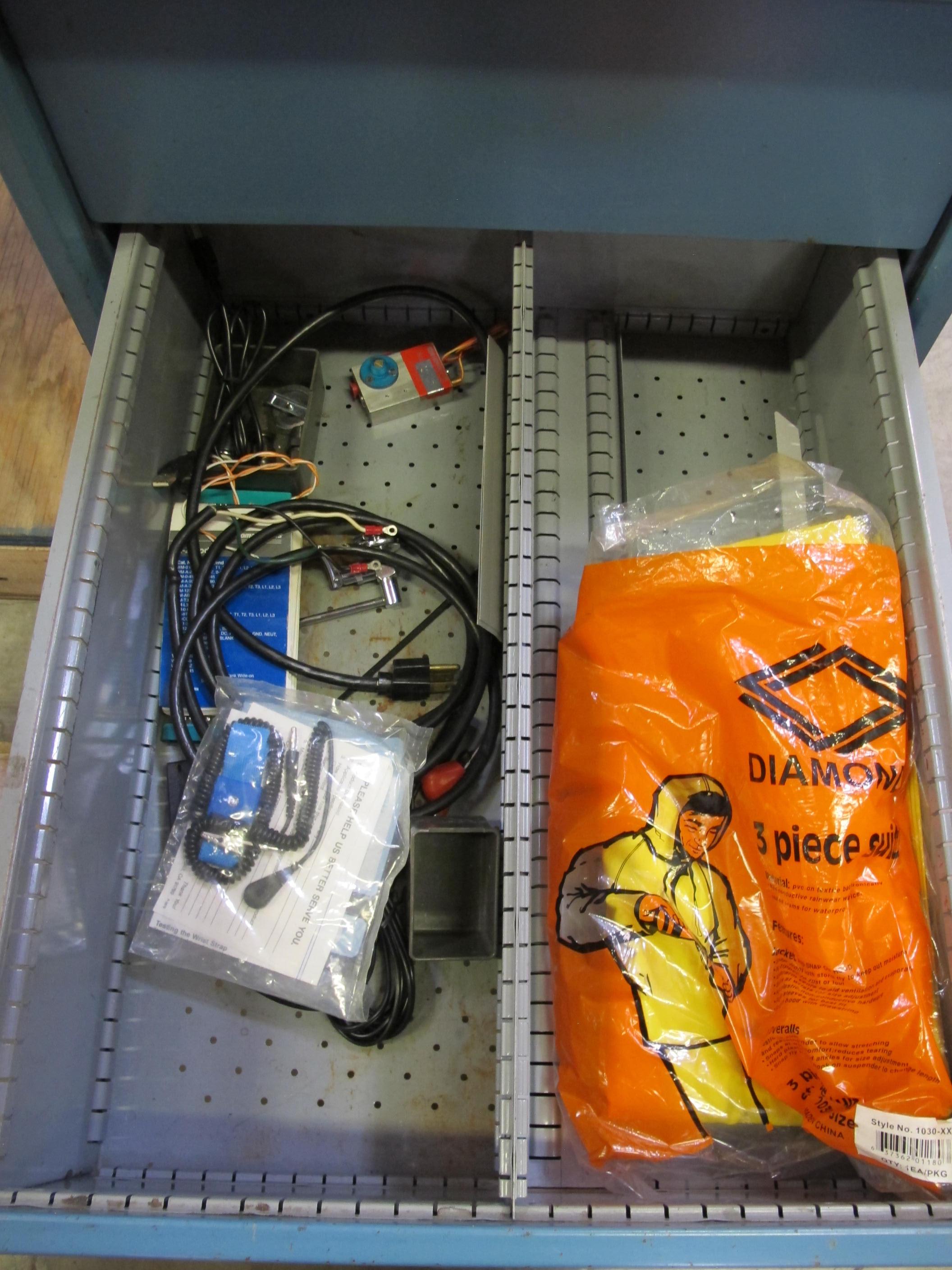 LISTA INDUSTRIAL WORK DESK, BUTCHER BLOCK TABLE TOP 48"L X 30"W, SHELF, 4 DRAWER CABINET WITH CONTENTS TO INCLUDE: EAR PLUGS, MISC. OFFICE SUPPLIES, WIRING, PRECISION SCREWDRIVERS, WATERPROOF RAINWEAR 3 PIECE SUIT. LOADING & HANDLING $15-1696