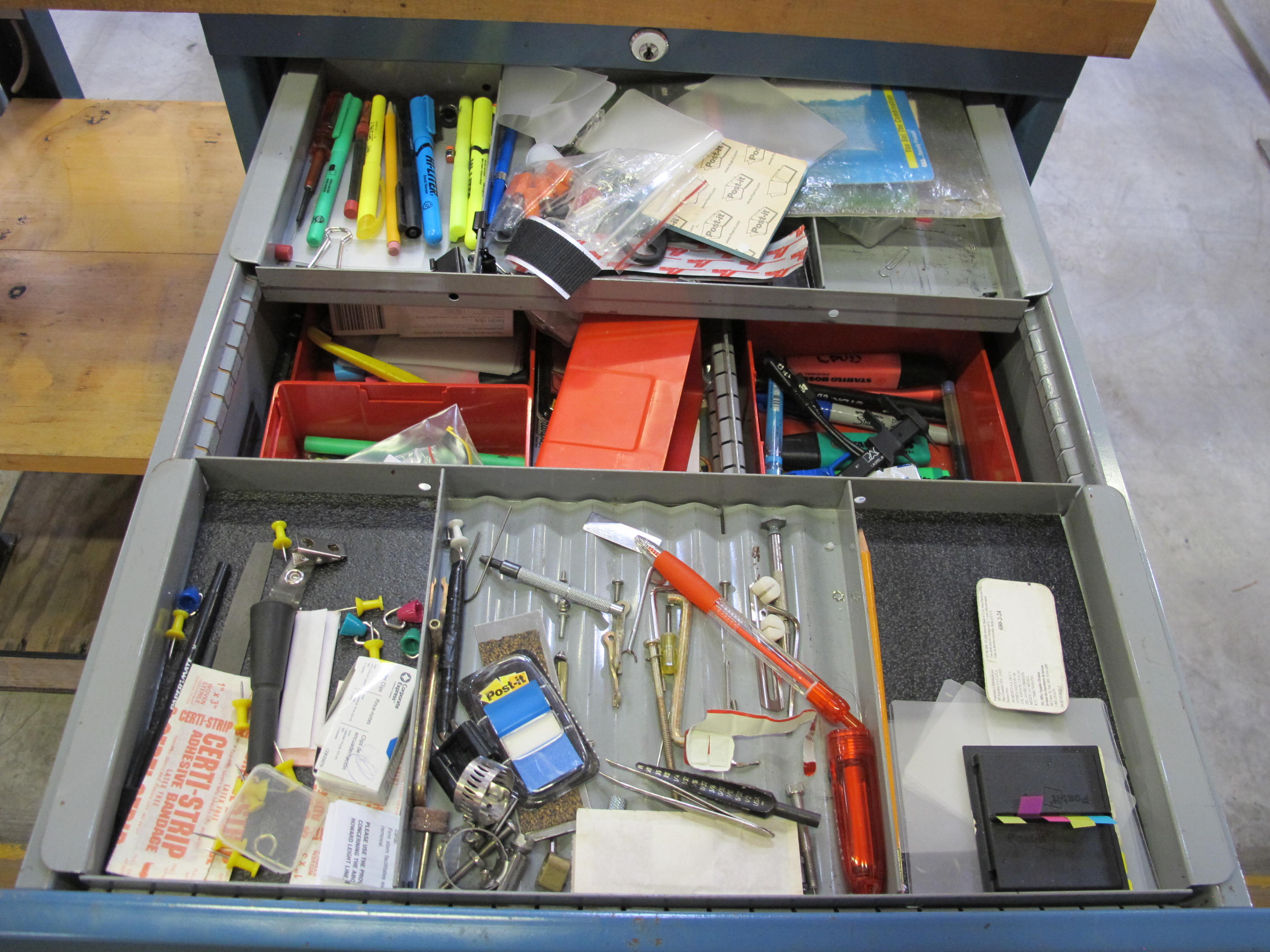 LISTA INDUSTRIAL WORK DESK, BUTCHER BLOCK TABLE TOP 48"L X 30"W, SHELF, 4 DRAWER CABINET WITH CONTENTS TO INCLUDE: MISC. OFFICE SUPPLIES, WIRING, BRUSH. LOADING & HANDLING $15-1697