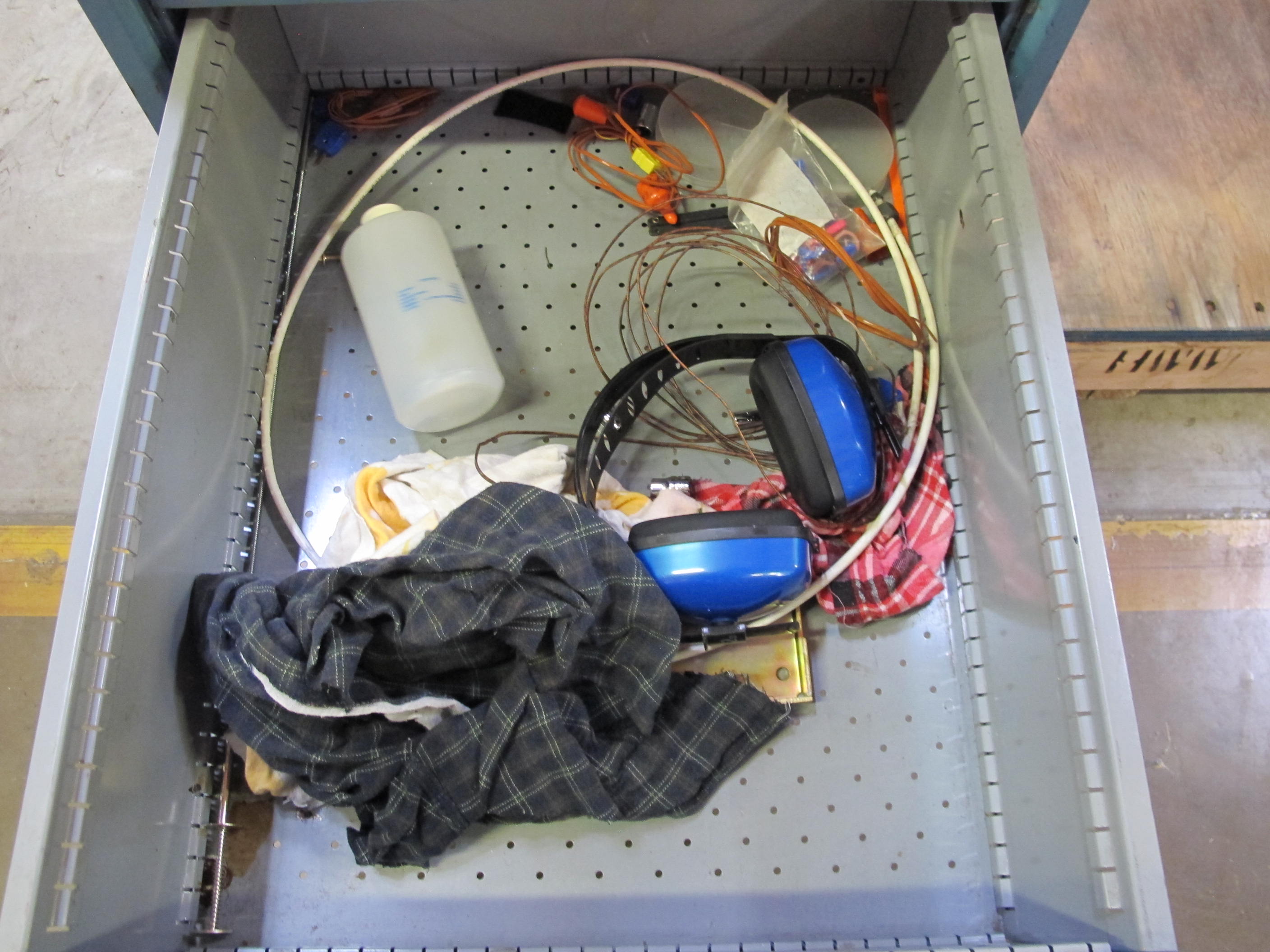 LISTA INDUSTRIAL WORK DESK, BUTCHER BLOCK TABLE TOP 48"L X 30"W, 4 DRAWER CABINET WITH CONTENTS TO INCLUDE: EAR PLUGS, MISC. OFFICE SUPPLIES, WIRING, BRUSH, EAR MUFFS. LOADING & HANDLING $15-1698