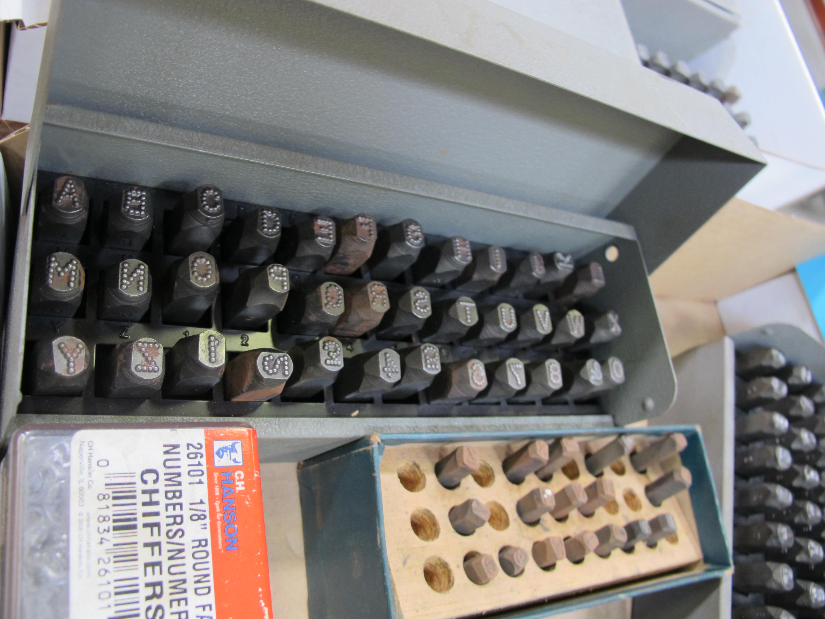 LOT TO INCLUDE STEEL STAMPS: (2) ALPHABETICAL SETS, 1/4", (1) ALPHABETICAL SET, 3/16", (2) NUMERICAL SETS, 1/8", (1) PARTIAL ALPHABETICAL SET-2115
