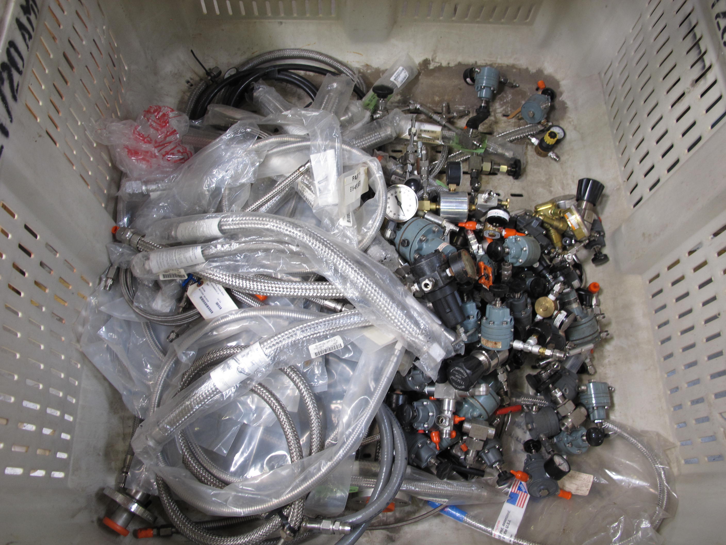 PALLETAINER LOT TO INCLUDE: LARGE QUANTITY OF SIEMENS, NULLMATIC, FAIRCHILD, TESCOM, EST, AND FISHER PRESSURE REGULATORS, GAUGES, AND FITTINGS,  SS BRAIDED FLEX PIPING-2169