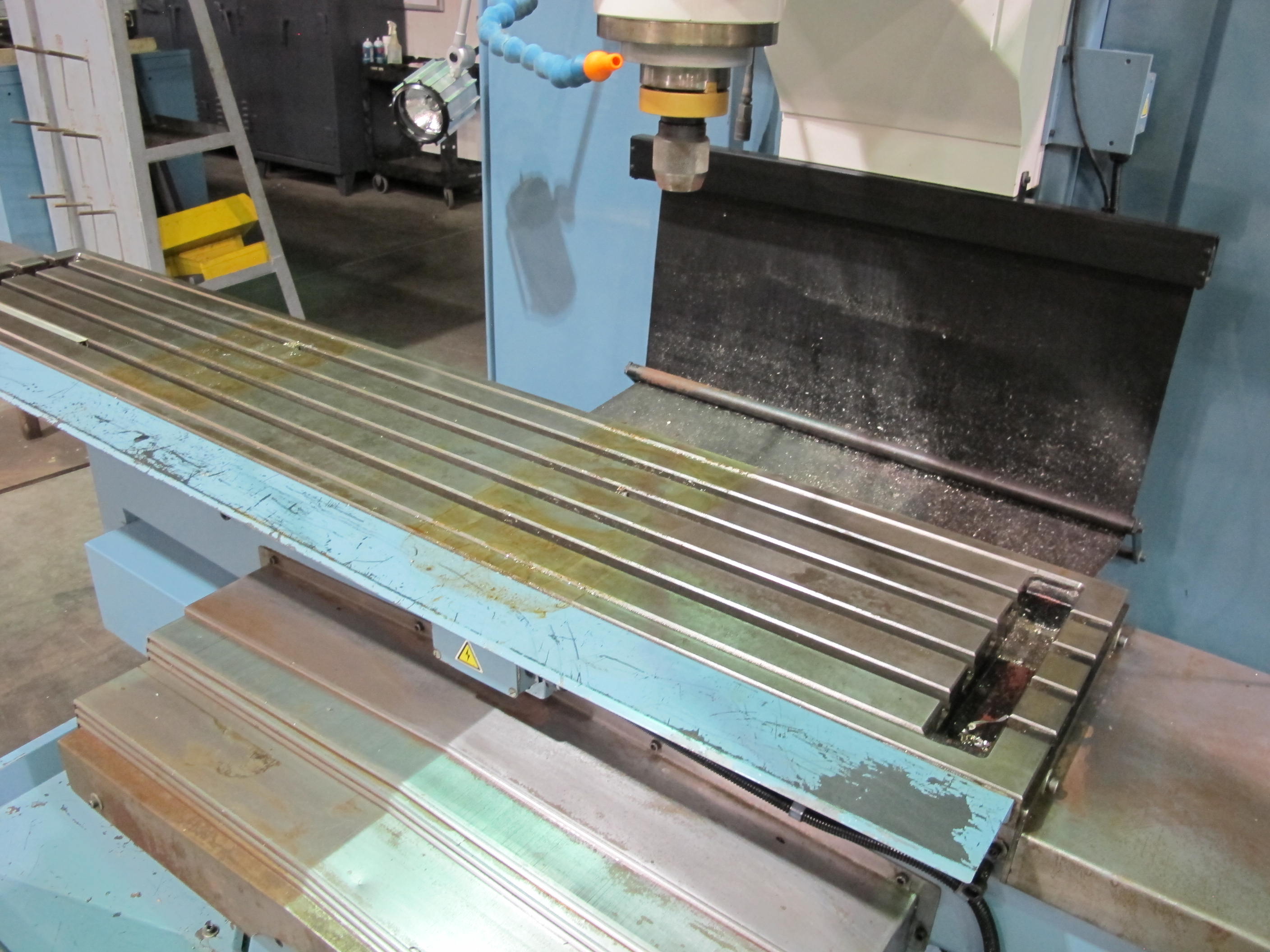 TRAK FHM 7 CNC BED MILL, TRAVELS: X-60" X Y-23" X Z-20.5", TABLE SIZE: 76" X 14", 40 TAPER SPINDLE, 200-5000 RPM, PROTO TRAK SMX CNC CONTROL, 7.5 HP, S/N 074CY15902 (T-10) LOADING & HANDLING FEE $500-258