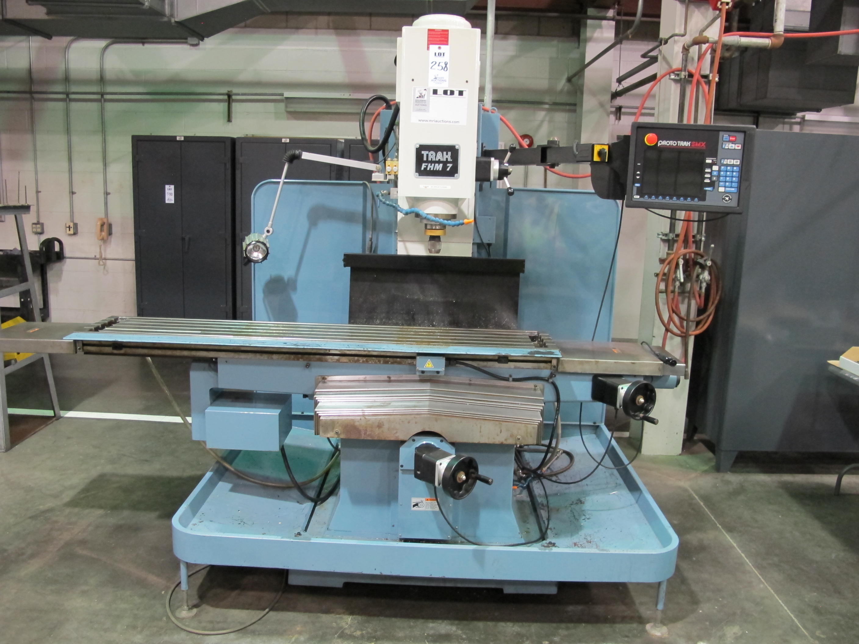 TRAK FHM 7 CNC BED MILL, TRAVELS: X-60" X Y-23" X Z-20.5", TABLE SIZE: 76" X 14", 40 TAPER SPINDLE, 200-5000 RPM, PROTO TRAK SMX CNC CONTROL, 7.5 HP, S/N 074CY15902 (T-10) LOADING & HANDLING FEE $500-258