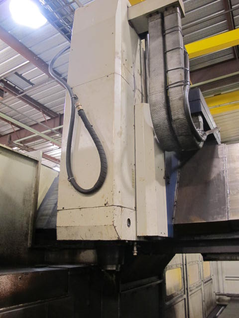 2001 VIPER V-4000 GXT VERTICAL BRIDGE MILL, TRAVELS: X-157.5", Y-77.60", Z-42.13", SPINDLE END TO COLUMN: 13.66", DISTANCE BETWEEN COLUMNS: 86.6" TABLE SIZE: 161.4" X 72", 24,250 TABLE LOAD, 6,000 RPM SPINDLE, CT 50 TAPER SPINDLE, 35 HP UPGRADE, SIDE MOUNT 60 ATC, FANUC 18MC CNC CONTROL, FANUC HPCC.64BIT RISC PR, COOL JET CHIP BLASTER, S/N 3733 (G-49) LOADING & HANDLING FEE $17,500-2187