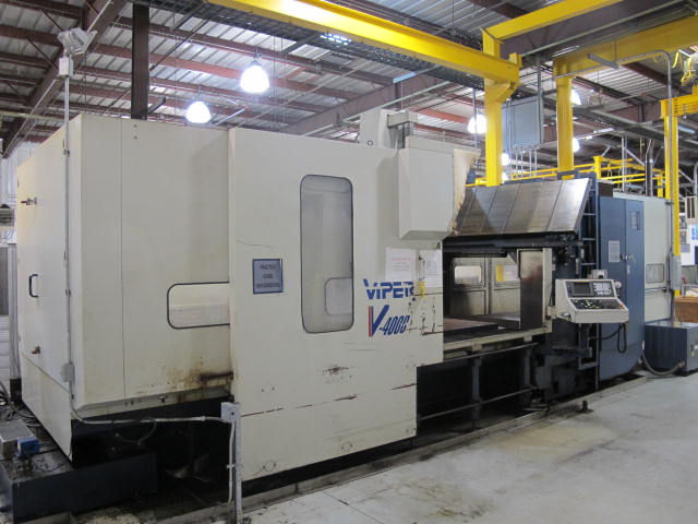 2001 VIPER V-4000 GXT VERTICAL BRIDGE MILL, TRAVELS: X-157.5", Y-77.60", Z-42.13", SPINDLE END TO COLUMN: 13.66", DISTANCE BETWEEN COLUMNS: 86.6" TABLE SIZE: 161.4" X 72", 24,250 TABLE LOAD, 6,000 RPM SPINDLE, CT 50 TAPER SPINDLE, 35 HP UPGRADE, SIDE MOUNT 60 ATC, FANUC 18MC CNC CONTROL, FANUC HPCC.64BIT RISC PR, COOL JET CHIP BLASTER, S/N 3733 (G-49) LOADING & HANDLING FEE $17,500-2187