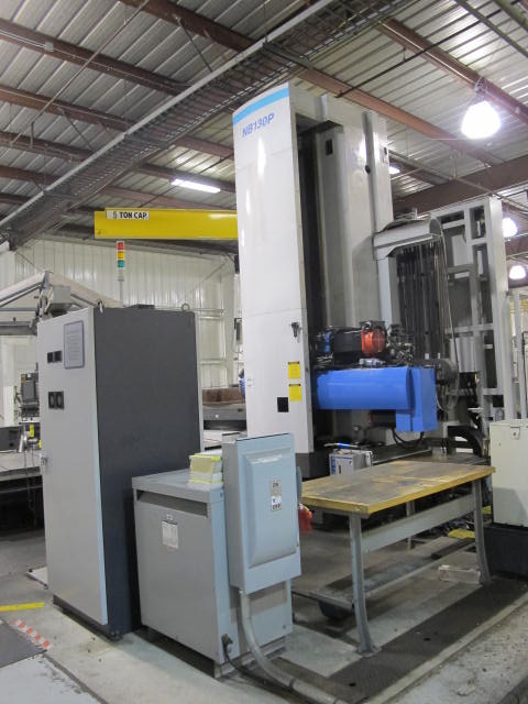 2003 SNK IKEGAI TABLE TYPE HORIZONTAL BORING MILL, NB 130P E3.5, 5.118" SPINDLE DIAMETER, TRAVELS: X-137", Y-98", Z-63", W-27.5", TABLE SIZE: 70.86" X 63", ROTARY TABLE CAPACITY: 22.045 LBS, 2,500 RPM SPINDLE SPEED, CAT 50 TAPER SPINDLE, COOLANT THRU SPINDLE, RIGID TAPPING, 35 HP, 60 ATC, COOL POWER, FANUC 16iMB CNC CONTROL, 5 AXIS SIMULTANEOUS CONTROL, STEEL WAY COVERS, CHIP CONVEYOR, S/N NB4002 (G-49) LOADING & HANDLING FEE $17,500-2188