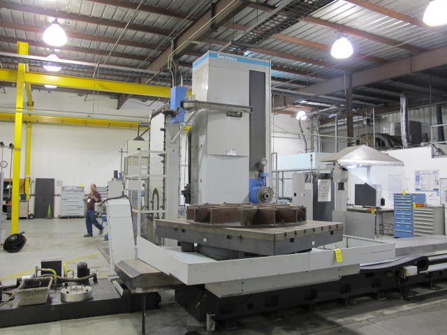 2003 SNK IKEGAI TABLE TYPE HORIZONTAL BORING MILL, NB 130P E3.5, 5.118" SPINDLE DIAMETER, TRAVELS: X-137", Y-98", Z-63", W-27.5", TABLE SIZE: 70.86" X 63", ROTARY TABLE CAPACITY: 22.045 LBS, 2,500 RPM SPINDLE SPEED, CAT 50 TAPER SPINDLE, COOLANT THRU SPINDLE, RIGID TAPPING, 35 HP, 60 ATC, COOL POWER, FANUC 16iMB CNC CONTROL, 5 AXIS SIMULTANEOUS CONTROL, STEEL WAY COVERS, CHIP CONVEYOR, S/N NB4002 (G-49) LOADING & HANDLING FEE $17,500-2188