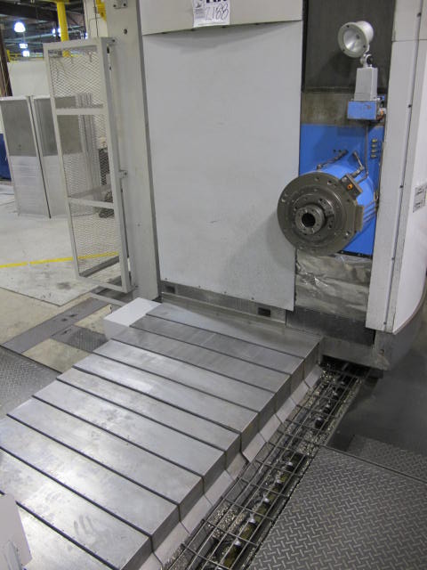 2003 SNK IKEGAI TABLE TYPE HORIZONTAL BORING MILL, NB 130P E3.5, 5.118" SPINDLE DIAMETER, TRAVELS: X-137", Y-98", Z-63", W-27.5", TABLE SIZE: 70.86" X 63", ROTARY TABLE CAPACITY: 22.045 LBS, 2,500 RPM SPINDLE SPEED, CAT 50 TAPER SPINDLE, COOLANT THRU SPINDLE, RIGID TAPPING, 35 HP, 60 ATC, COOL POWER, FANUC 16iMB CNC CONTROL, 5 AXIS SIMULTANEOUS CONTROL, STEEL WAY COVERS, CHIP CONVEYOR, S/N NB4002 (G-49) LOADING & HANDLING FEE $17,500-2188