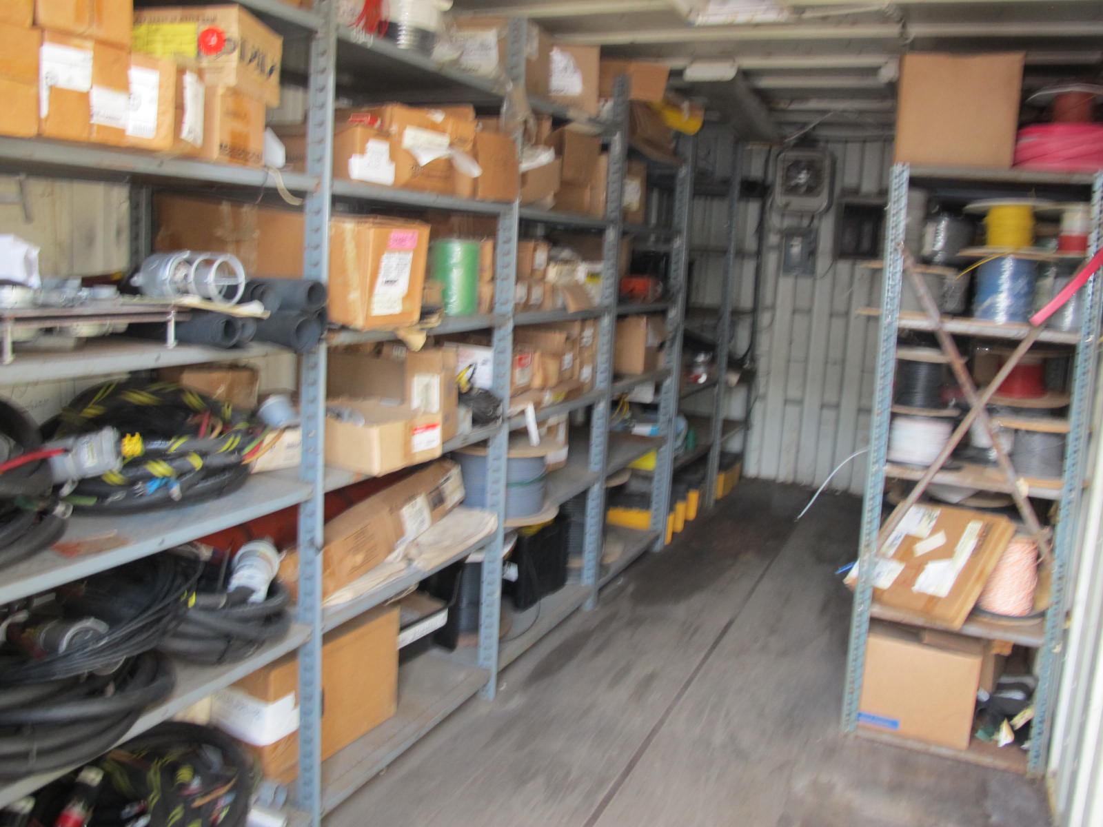 CONTENTS OF 8'X8'X20' STORAGE CONTAINER: "ELECTRICIANS DREAM II" LARGE QUANTITY OF: SPOOLS OF WIRE, COMMUNICATION CABLE, CLAMPS, SEALS, PLUGS, FITTINGS, LIGHTS, PLUS SO MUCH MORE. (G-20/#5) (TO BE PURCHASED ONLY BY AN INSURED BUYER, TO BE LOADED BY HAND. NO FORKLIFT USE ALLOWED.)-4408