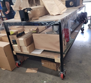 WORKBENCH ON CASTERS W  WOOD TOP 3 ft X 8 ft CONTENTS NOT INCLUDED-107