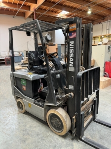 NISSAN ELECTRIC FORKLIFT, MODEL CP1B2L25S, 4,000 LB CAPACITY, 3-STAGE MAST, SIDE SHIFT, SOLID TIRES, 4' FORKS, LOAD LIGHTS, APPROX. 11,751 HOURS, S/N CP1B2-000219, W/ POWERHOUSE BATTERY CHARGER, (DELAYED PICKUP UNTIL FEBRUARY 20)-36