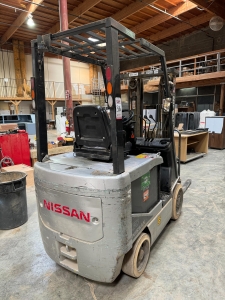 NISSAN ELECTRIC FORKLIFT, MODEL CP1B2L25S, 4,000 LB CAPACITY, 3-STAGE MAST, SIDE SHIFT, SOLID TIRES, 4' FORKS, LOAD LIGHTS, APPROX. 11,751 HOURS, S/N CP1B2-000219, W/ POWERHOUSE BATTERY CHARGER, (DELAYED PICKUP UNTIL FEBRUARY 20)-36