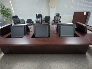 LOT - CONFERENCE ROOM GROUPING: CONFERENCE TABLE W/ FLIP-PANELS FOR MONITORS, AUDIO VIDEO CABINET W/ (2) 65" LCD SCREENS AND DIGITAL TIME ZONE CLOCK, FREESTANDING PODIUM, COLOR: MAHOGANY-189