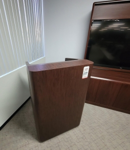 LOT - CONFERENCE ROOM GROUPING: CONFERENCE TABLE W/ FLIP-PANELS FOR MONITORS, AUDIO VIDEO CABINET W/ (2) 65" LCD SCREENS AND DIGITAL TIME ZONE CLOCK, FREESTANDING PODIUM, COLOR: MAHOGANY-189