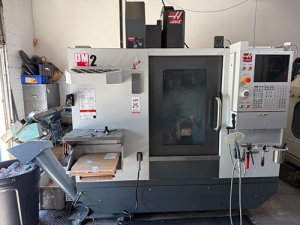 Haas-2022 HAAS DM-2 CNC VERTICAL DRILL/MILL MACHINING CENTER, MOLD MAKER, HAAS CNC CONTROL, TABLE: 34" X 15", XYZ TRAVELS: 28" X 16" X 15", CAT 40 TAPER, 15,000 RPM SPINDLE, SIDE MOUNT 18 ATC, 15 HP, THROUGH SPINDLE COOLANT, PROGRAMMABLE COOLANT NOZZLE, 32 GB EXPANDED MEMORY, WIRELESS INTUITIVE PROBING, TOOL AIR BLAST, CHIP CONVEYOR, 4TH AXIS READY, SUBPLATE, S/N 1197026-25