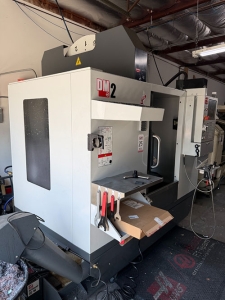 Haas-2022 HAAS DM-2 CNC VERTICAL DRILL/MILL MACHINING CENTER, MOLD MAKER, HAAS CNC CONTROL, TABLE: 34" X 15", XYZ TRAVELS: 28" X 16" X 15", CAT 40 TAPER, 15,000 RPM SPINDLE, SIDE MOUNT 18 ATC, 15 HP, THROUGH SPINDLE COOLANT, PROGRAMMABLE COOLANT NOZZLE, 32 GB EXPANDED MEMORY, WIRELESS INTUITIVE PROBING, TOOL AIR BLAST, CHIP CONVEYOR, 4TH AXIS READY, SUBPLATE, S/N 1197026-25