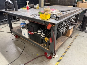 WELDING FABRICATION TABLE W/ 6' X 10' X 1/2" THICK STEEL TOP, 37" TOP HT, ON STEEL CASTERS, CONTENTS NOT INCLUDED-34