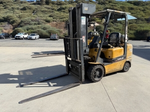 2004 CATERPILLAR LPG FORKLIFT, MODEL GC30K, 6,000 LB CAPACITY, 4-STAGE MAST, SIDE SHIFT, 5' FORKS, SOLID CUSHION TIRES, LOAD LIGHTS, REARVIEW MIRRORS, REAR SAFETY BEACON, CLEARCAP RAINCAP, APPROX. 8,077 HOURS, S/N AT83E00502, (DELAYED PICKUP UNTIL TUESDAY, AUGUST 18)-64