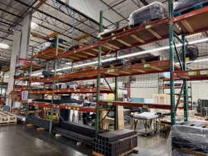 LOT - (8) SECTIONS OF PALLET RACKING, (5) 10' BEAMS, (2) 93" BEAMS, (1) 4' BEAM, 42" X 16' UPRIGHTS, PLYWOOD DECKING, CONTENTS NOT INCLUDED-137