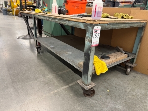 STEEL TABLE ON CASTERS W/ 8'-5" X 3' WOOD TOP, 31" TOP HT, CONTENTS NOT INCLUDED-158