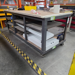 STEEL TABLE ON CASTERS W/ 8'-4" X 3' WOOD TOP, 43" TOP HT, CONTENTS NOT INCLUDED-162