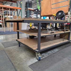 STEEL TABLE ON CASTERS W/ 12' X 4' WOOD TOP, 37" TOP HT, CONTENTS NOT INCLUDED-170