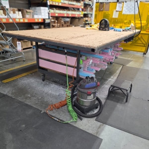 STEEL TABLE ON CASTERS W/ 10' X 6'-3" WOOD TOP, 40" TOP HT, CONTENTS NOT INCLUDED-171