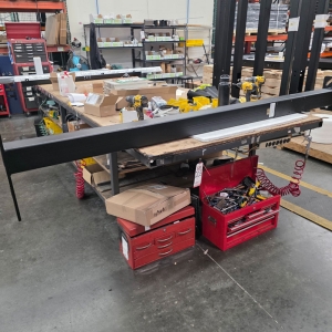 STEEL TABLE ON CASTERS W/ 14' X 5' WOOD TOP, 36" TOP HT, CONTENTS NOT INCLUDED-205