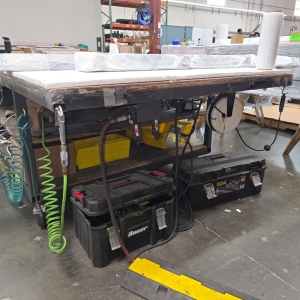 STEEL TABLE ON CASTERS W/ 14' X 5' WOOD TOP, 36" TOP HT, CONTENTS NOT INCLUDED-205