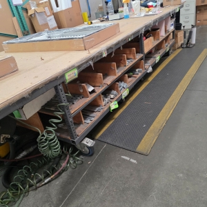 STEEL TABLE ON CASTERS W/ 14' X 5' WOOD TOP, CONTENTS NOT INCLUDED-215