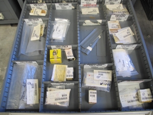 STANLEY VIDMAR CABINET, 11 DRAWER, TO INCLUDE: TUBE PLUGS, VALVES, SPRINGS, PINS, CIRCUIT BREAKERS, CAPACITORS. LOCATED AT W-44. LOADING AND HANDLING FEE $25-370