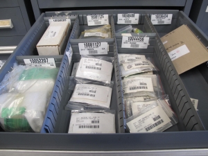 STANLEY VIDMAR CABINET, 11 DRAWER, TO INCLUDE: GASKETS, PRESSURE REGULATORS, INCANDESCENT LIGHTS, COUPLING SLEEVES, PRINTEDC CIRCUIT BOARDS, AIR FILTERS, BUSHINGS. LOCATED AT W-44. LOADING AND HANDLING FEE $25-371