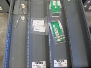 STANLEY VIDMAR CABINET, 11 DRAWER, TO INCLUDE: GASKETS, PRESSURE REGULATORS, INCANDESCENT LIGHTS, COUPLING SLEEVES, PRINTEDC CIRCUIT BOARDS, AIR FILTERS, BUSHINGS. LOCATED AT W-44. LOADING AND HANDLING FEE $25-371
