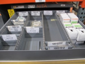 STANLEY VIDMAR CABINET, 11 DRAWER, TO INCLUDE: LIGHT BULBS, CHECK VALVES, PNUEMATIC TIME DELAY ATTACHMENTS, DEFLECTORS, CAMERA LENS, RECTIFIER, MISC MODULES, PRESSURE GAUGE, COMPRESSOR PISTONS. LOCATED AT W-50 . LOADING AND HANDLING FEE $25-372