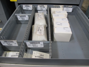 STANLEY VIDMAR CABINET, 11 DRAWER, TO INCLUDE: LIGHT BULBS, CHECK VALVES, PNUEMATIC TIME DELAY ATTACHMENTS, DEFLECTORS, CAMERA LENS, RECTIFIER, MISC MODULES, PRESSURE GAUGE, COMPRESSOR PISTONS. LOCATED AT W-50 . LOADING AND HANDLING FEE $25-372