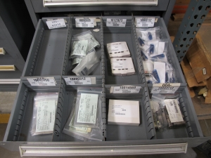 STANLEY VIDMAR CABINET, 11 DRAWER, TO INCLUDE: LIGHT BULBS, CHECK VALVES, PNUEMATIC TIME DELAY ATTACHMENTS, DEFLECTORS, CAMERA LENS, RECTIFIER, MISC MODULES, PRESSURE GAUGE, COMPRESSOR PISTONS. LOCATED AT W-50 . LOADING AND HANDLING FEE $25-372