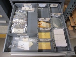 STANLEY VIDMAR CABINET, 11 DRAWER, TO INCLUDE: LIGHT BULBS, CHECK VALVES, PNUEMATIC TIME DELAY ATTACHMENTS, DEFLECTORS, CAMERA LENS, RECTIFIER, MISC MODULES, PRESSURE GAUGE, COMPRESSOR PISTONS. LOCATED AT W-50 . LOADING AND HANDLING FEE $25-372