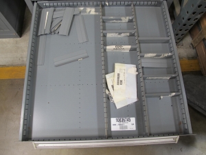 STANLEY VIDMAR CABINET, 11 DRAWER, TO INCLUDE: LIGHT BULBS, CHECK VALVES, PNUEMATIC TIME DELAY ATTACHMENTS, DEFLECTORS, CAMERA LENS, RECTIFIER, MISC MODULES, PRESSURE GAUGE, COMPRESSOR PISTONS. LOCATED AT W-50 . LOADING AND HANDLING FEE $25-372