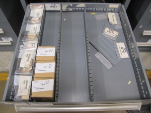 STANLEY VIDMAR CABINET, 11 DRAWER, TO INCLUDE: AMP METER, THERMOSTAT, TRANSMITTER ASSEMBLY, CONNECTOR SLEEVES, SPECTROME AMPLIFIER, PILOT RELAY, FUSES, FLOAT MONELS, CORDS. LOCATED AT W-50 . LOADING AND HANDLING FEE $25-374