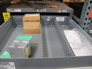 STANLEY VIDMAR CABINET, 11 DRAWER, TO INCLUDE: POWER MONITORS, ELECTRICAL CONNECTORS, CONDUCTORS, COMPRESSOR CIRCUITS, TERMINAL BLOCKS, HEX NUTS, LED LIGHTS, MODULES, VOLT METERS. LOCATED AT W-50 . LOADING AND HANDLING FEE $25-376