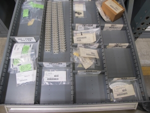 STANLEY VIDMAR CABINET, 11 DRAWER, TO INCLUDE: POWER MONITORS, ELECTRICAL CONNECTORS, CONDUCTORS, COMPRESSOR CIRCUITS, TERMINAL BLOCKS, HEX NUTS, LED LIGHTS, MODULES, VOLT METERS. LOCATED AT W-50 . LOADING AND HANDLING FEE $25-376