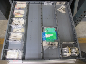 STANLEY VIDMAR CABINET, 11 DRAWER, TO INCLUDE: POWER MONITORS, ELECTRICAL CONNECTORS, CONDUCTORS, COMPRESSOR CIRCUITS, TERMINAL BLOCKS, HEX NUTS, LED LIGHTS, MODULES, VOLT METERS. LOCATED AT W-50 . LOADING AND HANDLING FEE $25-376