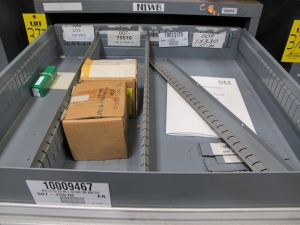 STANLEY VIDMAR CABINET, 11 DRAWER, TO INCLUDE: VOLT METERS, THERMOCOUPLE WIRE, BALLASTS, GROMMETS, ROLLERS, BLANK METERS, SUPPRESSORS. LOCATED AT W-50 . LOADING AND HANDLING FEE $25-377