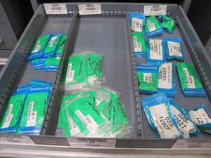 STANLEY VIDMAR CABINET, 11 DRAWER, TO INCLUDE: VOLT METERS, THERMOCOUPLE WIRE, BALLASTS, GROMMETS, ROLLERS, BLANK METERS, SUPPRESSORS. LOCATED AT W-50 . LOADING AND HANDLING FEE $25-377