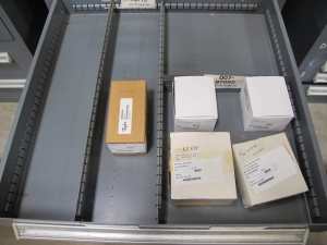 STANLEY VIDMAR CABINET, 11 DRAWER, TO INCLUDE: VOLT METERS, THERMOCOUPLE WIRE, BALLASTS, GROMMETS, ROLLERS, BLANK METERS, SUPPRESSORS. LOCATED AT W-50 . LOADING AND HANDLING FEE $25-377