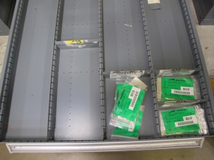 STANLEY VIDMAR CABINET, 11 DRAWER, TO INCLUDE: VOLT METERS, THERMOCOUPLE WIRE, BALLASTS, GROMMETS, ROLLERS, BLANK METERS, SUPPRESSORS. LOCATED AT W-50 . LOADING AND HANDLING FEE $25-377